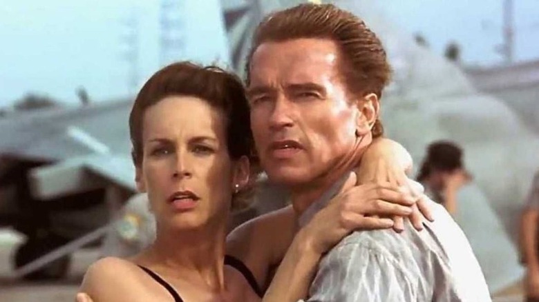 Curtis and Schwarzenegger embrace