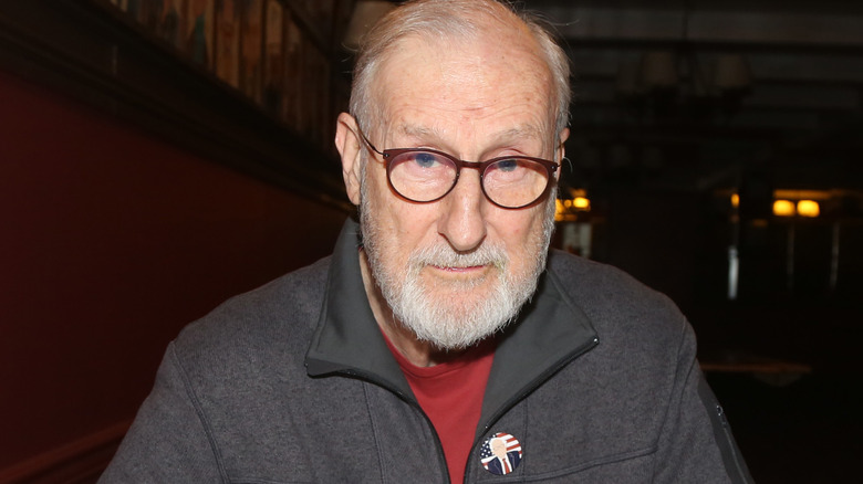 James Cromwell in dark restaurant