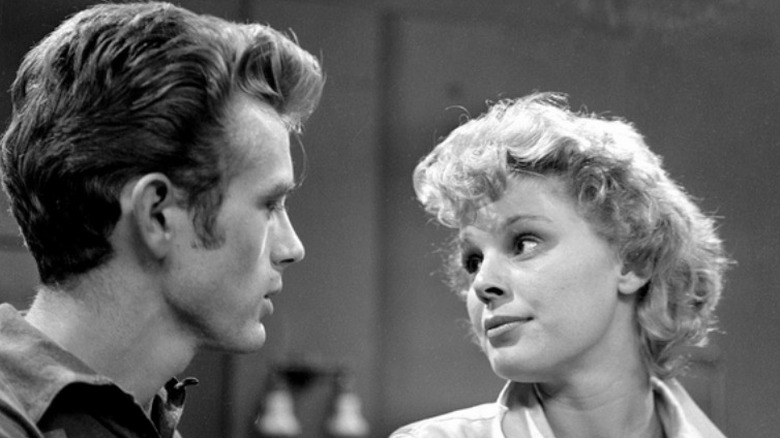 James Dean looking at Betsy Palmer