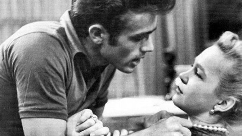 James Dean clutching on to a woman