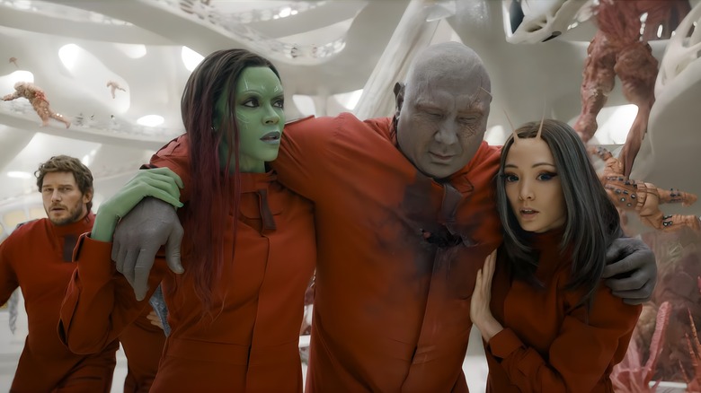 Gamora and Nebula carrying Drax