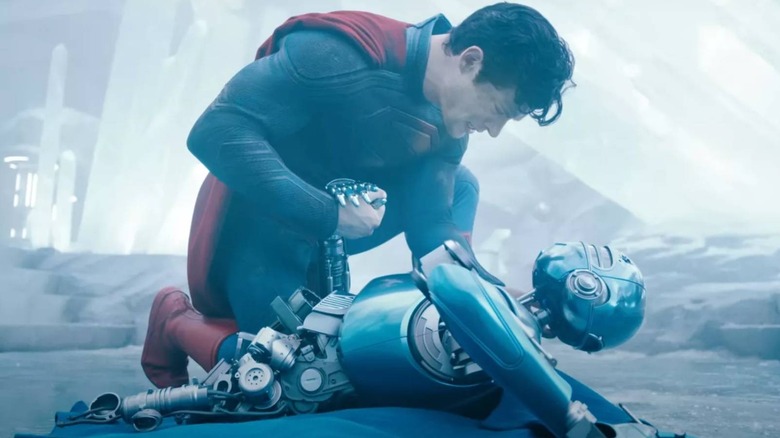 Superman holding hands with a robot in the Superman trailer