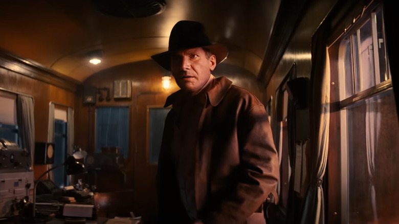 Indiana Jones standing on a train