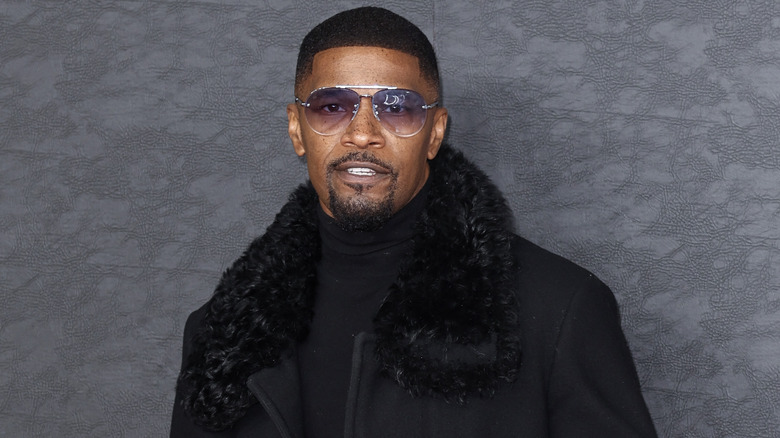 Jamie Foxx sunglasses black coat