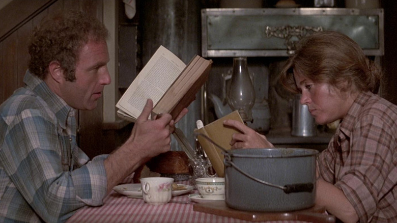 Jane Fonda reads at a table