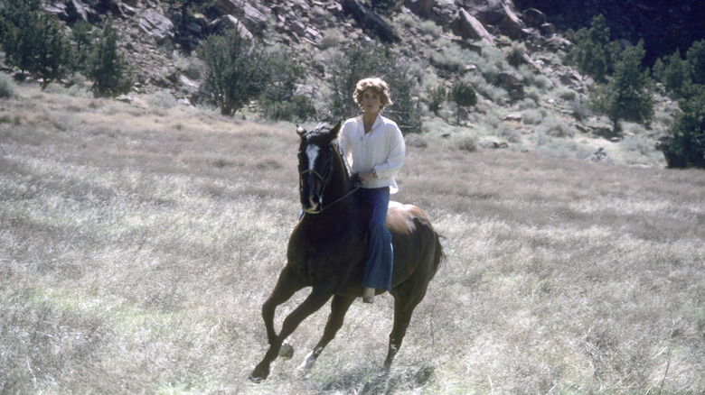 Jane Fonda rides a horse