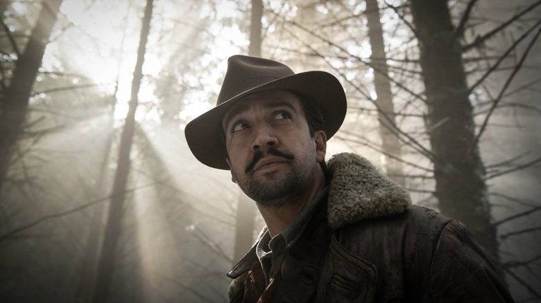 Lee Scoresby with hat in woods in His Dark Materials