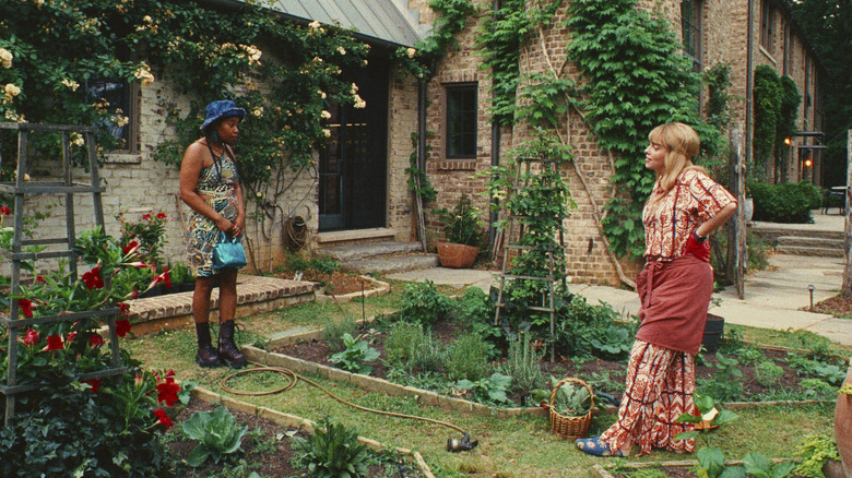 Dre talking to Eva in her garden