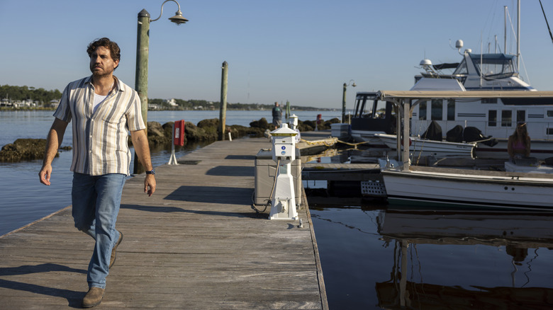 Mike Valentine walking on a boat dock