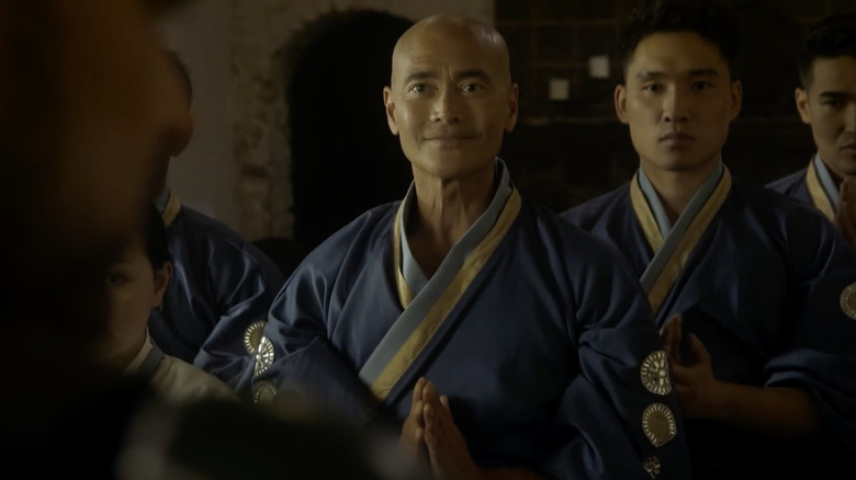 Xang wearing a blue robe