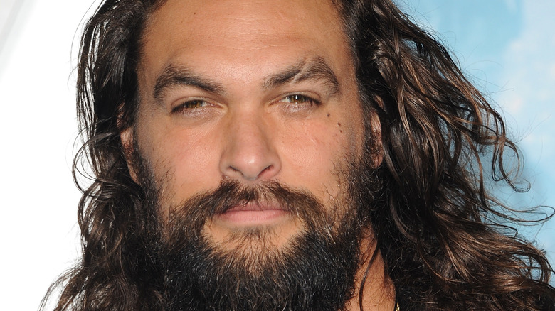 Jason Momoa looking into camera