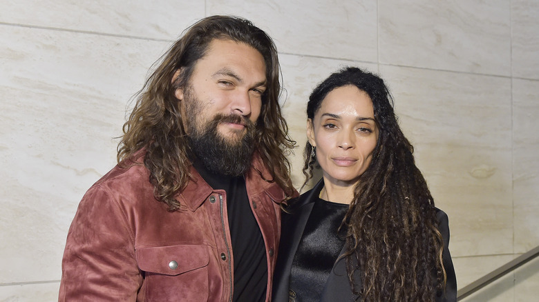 Jason Momoa and Lisa Bonet posing