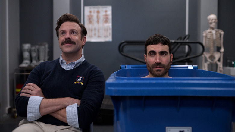 Ted Lasso next to Roy Kent sitting in ice bin