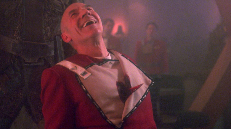 Picard laughs with a dagger stabbed through his heart