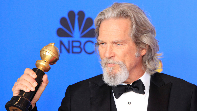 Jeff Bridges holding award