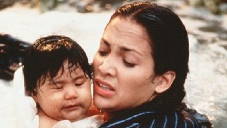 Jennifer Lopez holding a baby