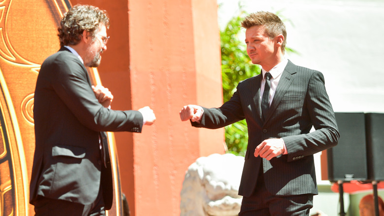 Mark Ruffalo fist bumping Jeremy Renner