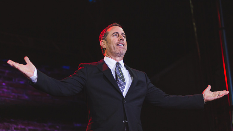 Jerry Seinfeld with arms outstretched 