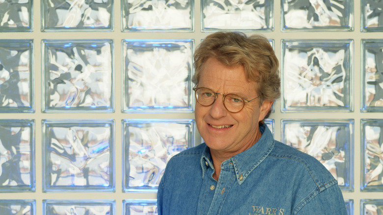 Springer smiling in front of glass