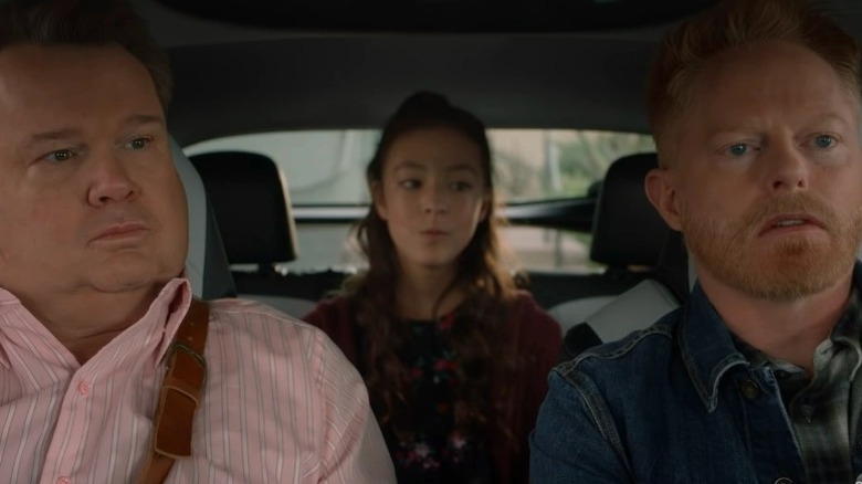 Cam, Lily, and Mitch sitting in a car