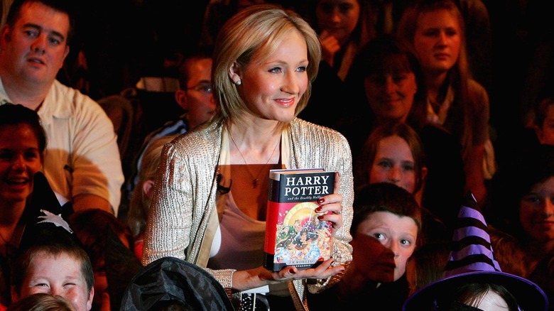 JK Rowling holding book