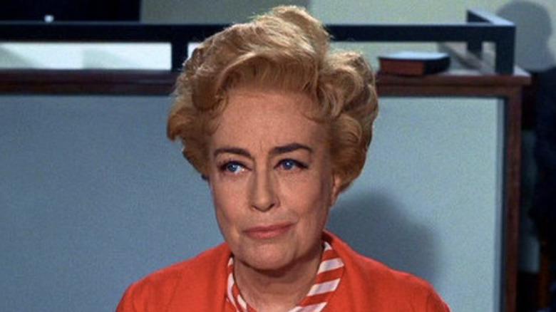 Joan Crawford smirks