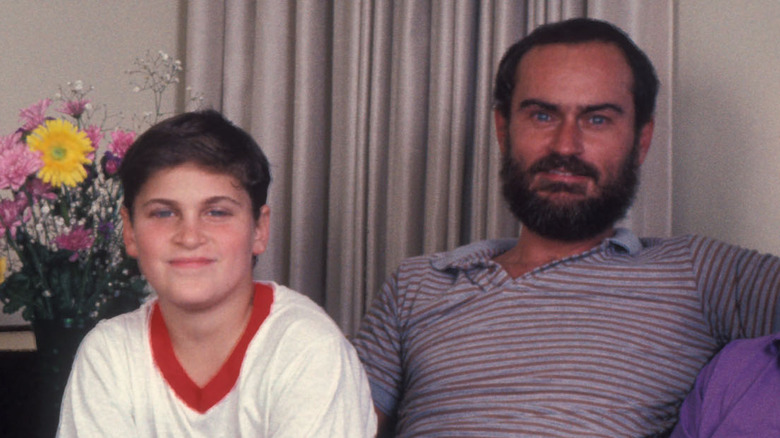 Joaquin Phoenix smiling with father