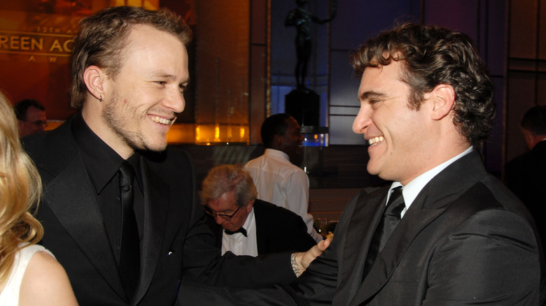 Heath Ledger and Joaquin Phoenix laughing