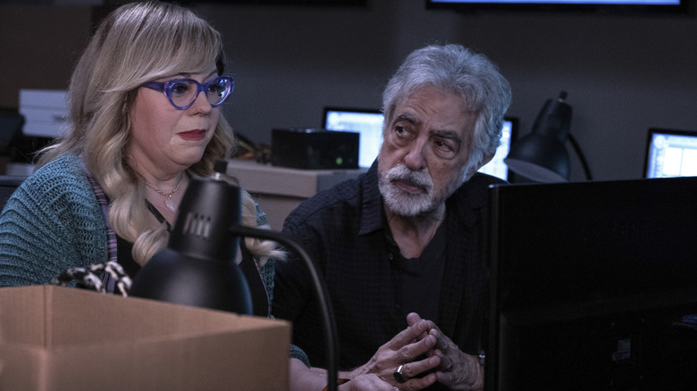 Kirsten Vangsness as Penelope Garcia and Joe Mantegna as David Rossi at desk in Criminal Minds: Evolution