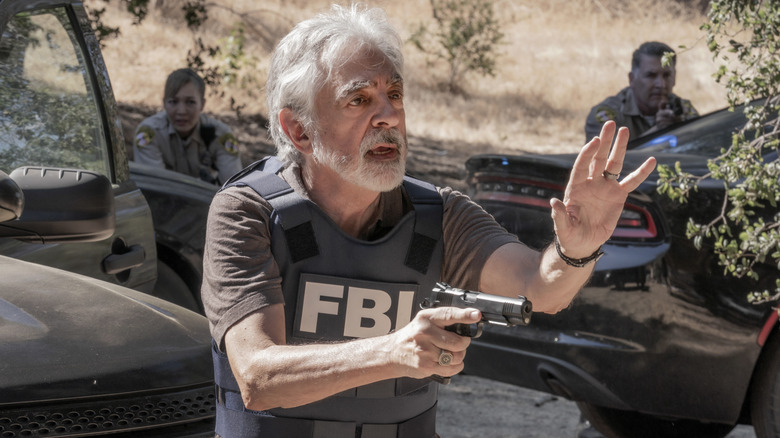 Joe Mantegna as David Rossi with gun in Criminal Minds: Evolution