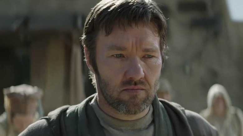 Joel Edgerton frowning as Owen Lars