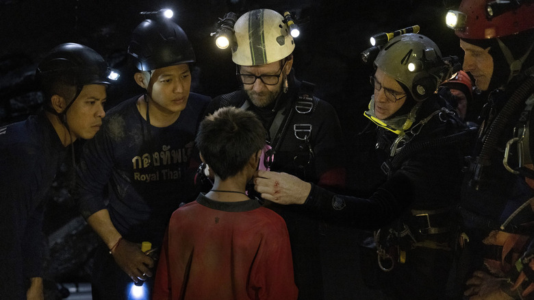 Cave divers rescuing a kid