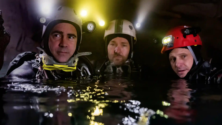 Cave divers in water