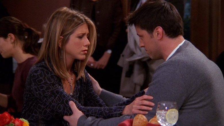 Rachel Greene and Joey Tribbiani touching 