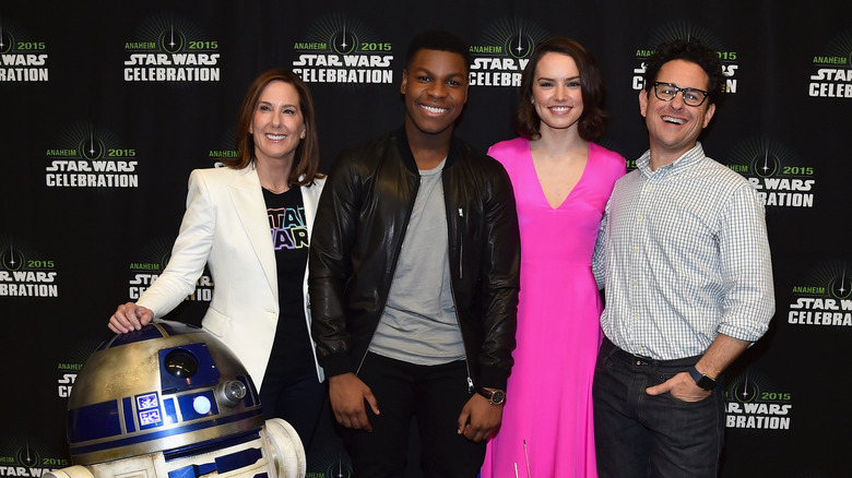 Kathleen Kennedy, John Boyega, J.J. Abrams, and Daisy Ridley smiling