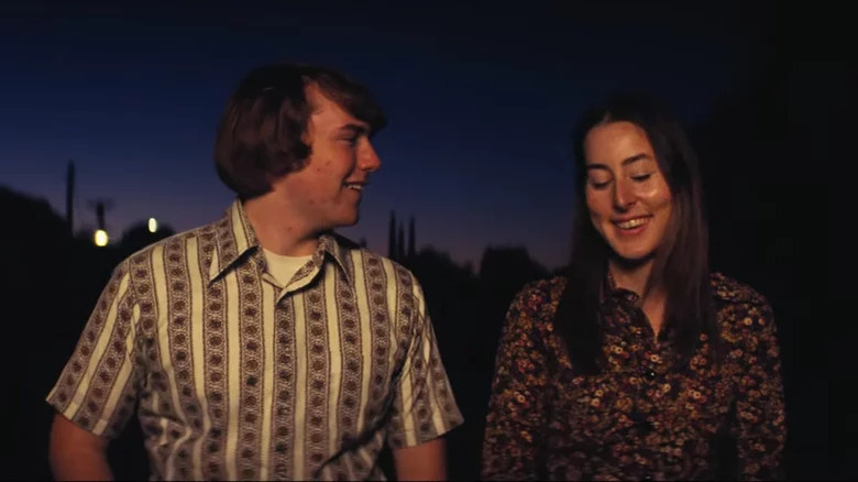 Cooper Hoffman and Alana Haim laughing