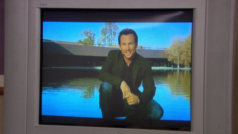 Christian Slater on a TV screen