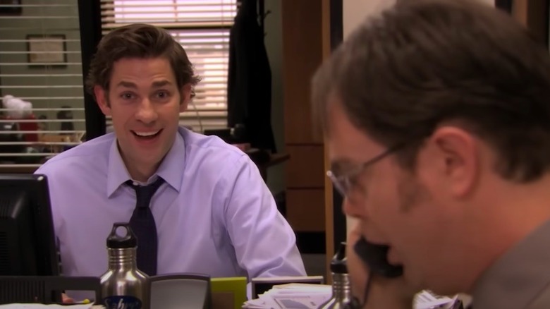 Jim watches Dwight on phone