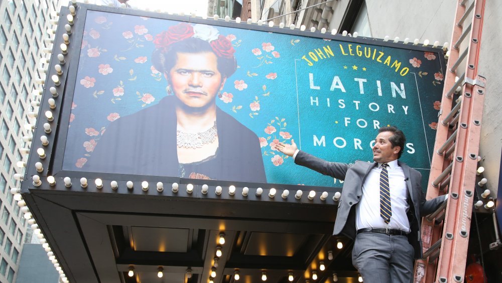 John Leguizamo shows off the marquee for his one-man show Latin History for Morons