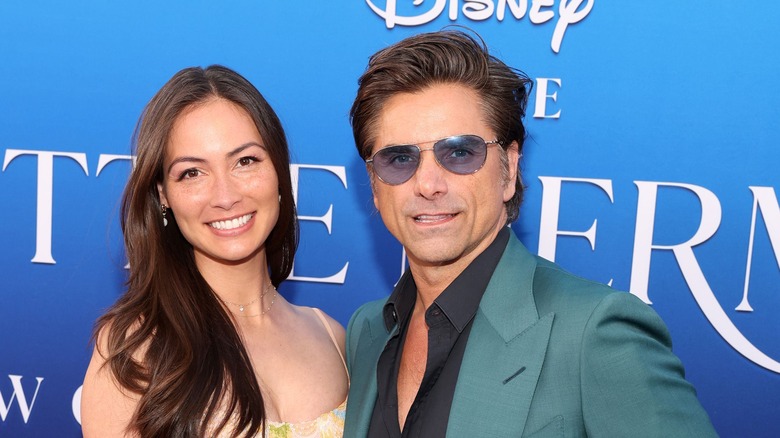 Stamos posing with his wife