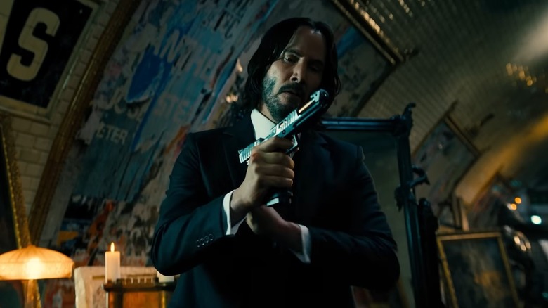 John Wick holding a gun