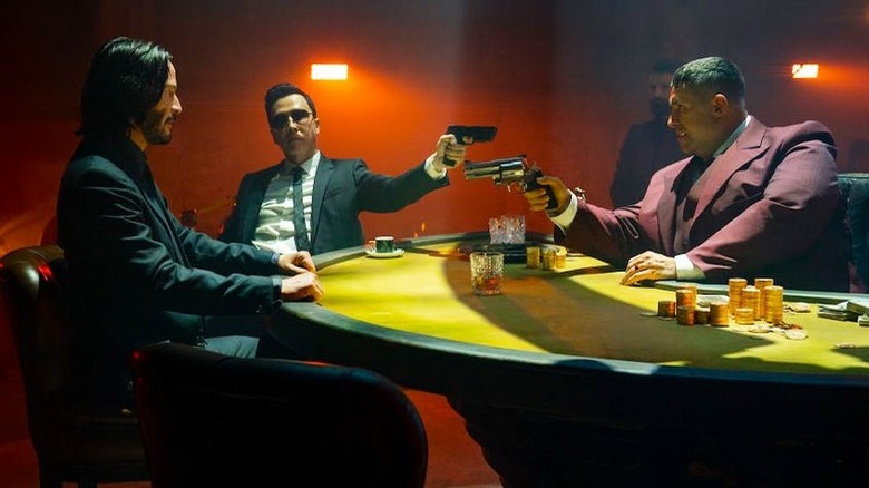 John Wick, Caine, and Killa at poker table