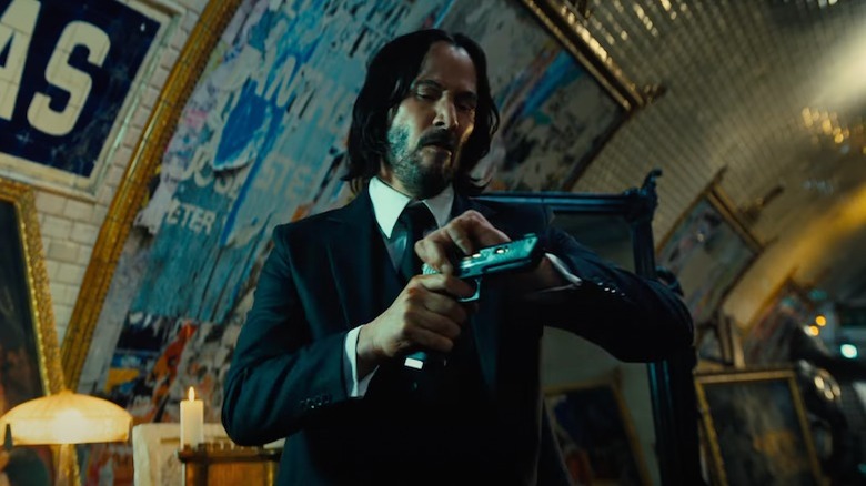 John Wick holding a gun