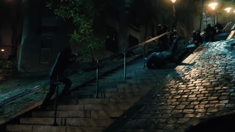 John shooting at enemy fighters on the stairs to Sacre Coeur