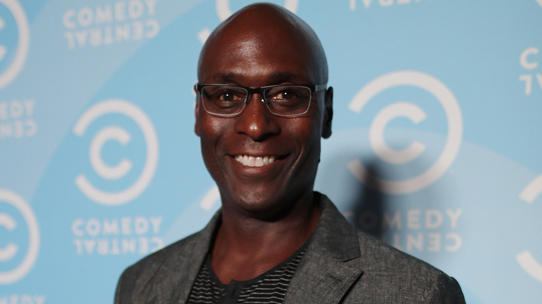 Lance Reddick at event smiling