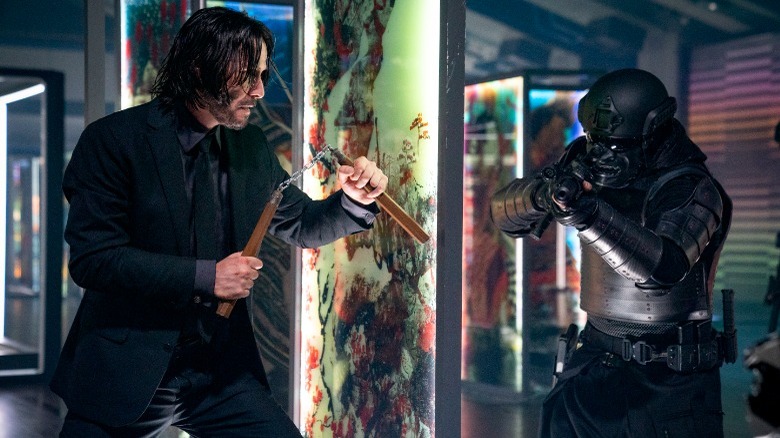 John Wick fighting guy w/nunchucks