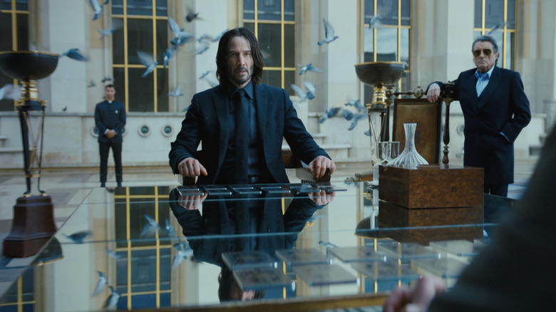 John Wick at a table