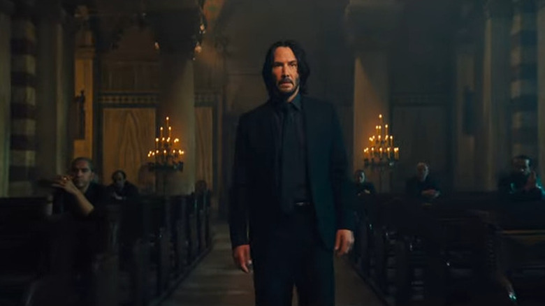 Keanu Reeves walking in a church