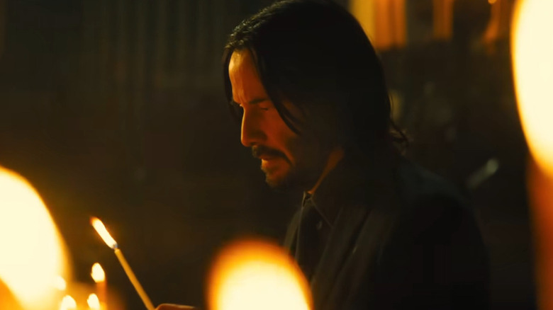 John Wick lights a candle