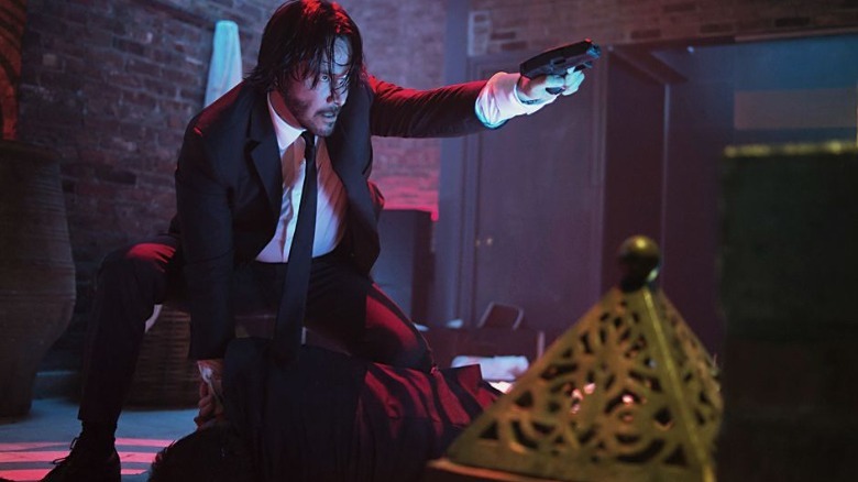 John Wick holding a gun